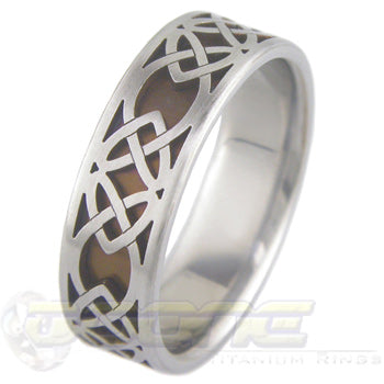 classic celtic hearts design laser cut on outer titanium ring and laser welded to inner ring which can be anodized to color of your choosing