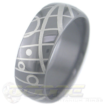 geometric design laser engraved on black zirconium ring with white on black motif known as tuxedo
