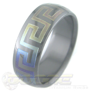 greek key design laser engraved on black zirconium ring with varied color fades known as chroma 