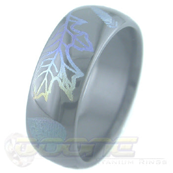 leaves design laser engraved on black zirconium ring with varied color fades known as chroma