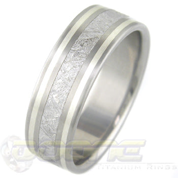 flat profile titanium ring with center inlay of meteorite and twin sterling silver inlays on each side of meteorite