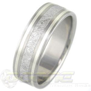 flat profile titanium ring with center inlay of meteorite and twin sterling silver inlays on each side of meteorite