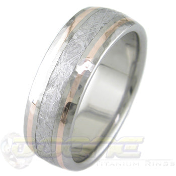 titanium ring with center inlay of meteorite and twin 14 karat rose gold inlays on each side of meteorite