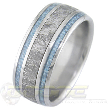 titanium ring with wide center meteorite inlay and twin light blue carbon fiber inlays on each side of meteorite