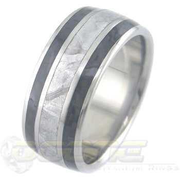 titanium ring with wide center meteorite inlay and twin black carbon fiber inlays on each side of meteorite