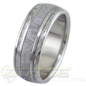 titanium ring with wide center inlay of meteorite and twin silver carbon fiber inlays on each side of meteorite