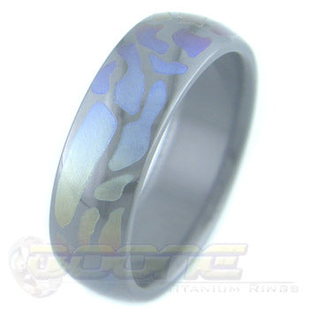 path design laser engraved on black zirconium ring with varied color fades known as chroma