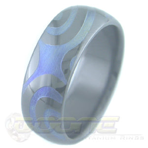 torque design laser engraved on black zirconium ring with varied color fades known as chroma