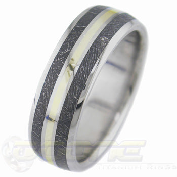titanium ring with center inlay of gold and twin blackened meteorite inlay on each side of gold inlay